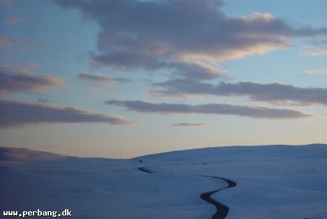 White snow black road -